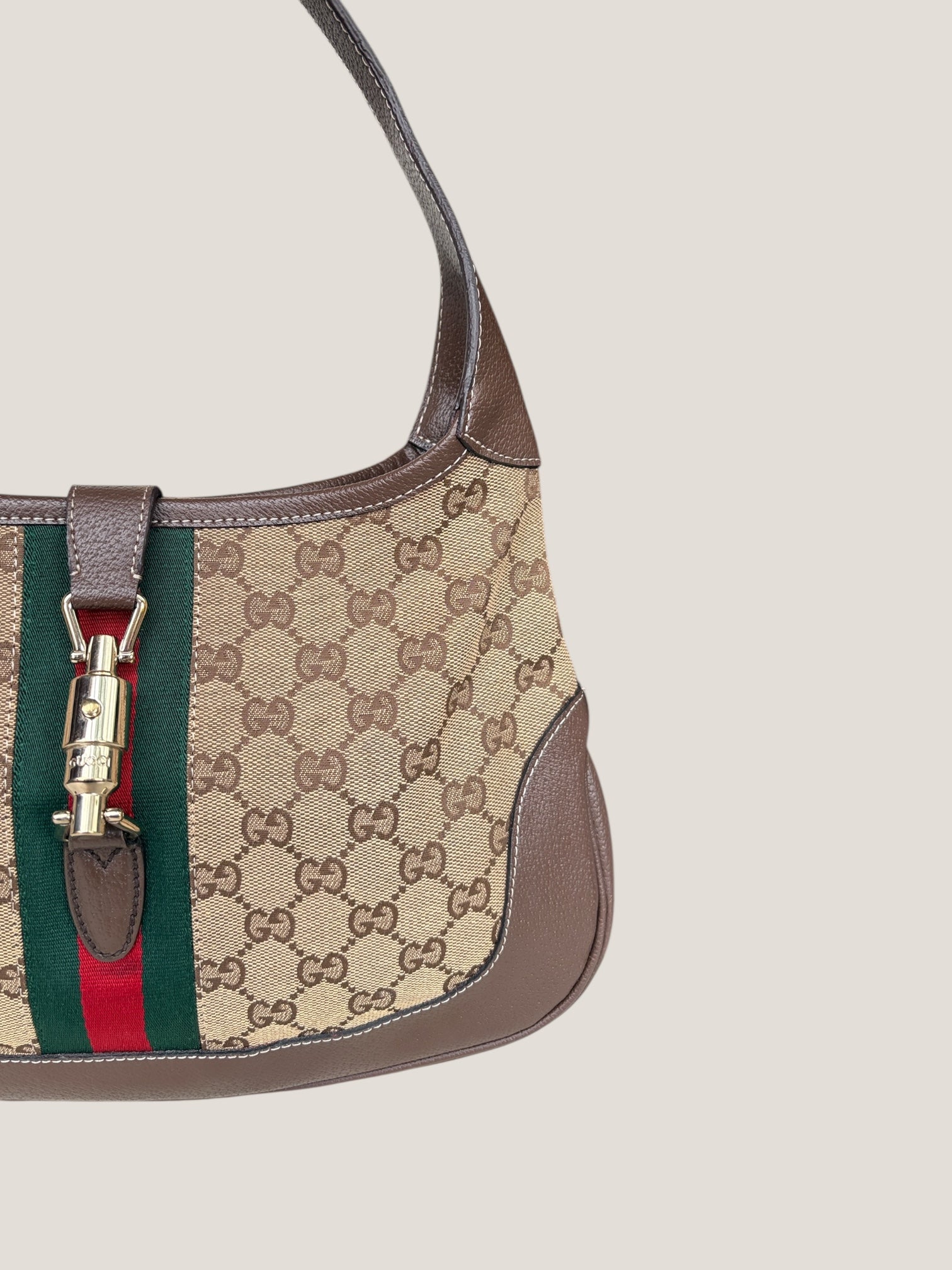 Gucci Jackie GG Canvas con dettaglio Piston