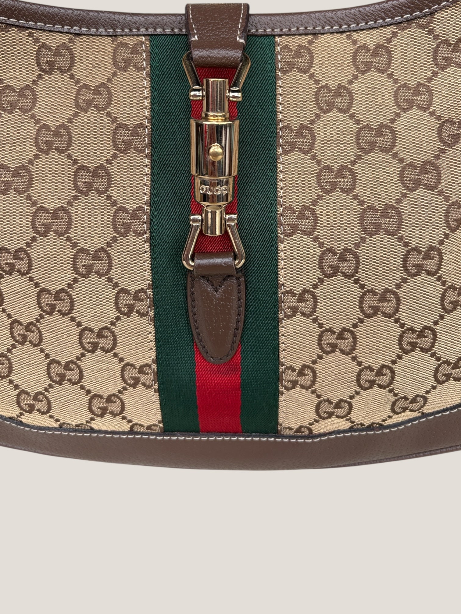 Gucci Jackie GG Canvas con dettaglio Piston